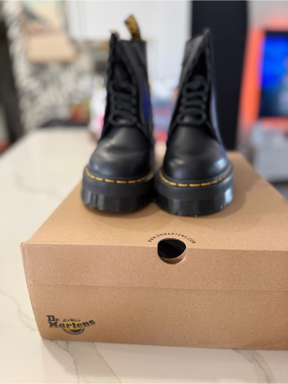 Dr. Martens Black Leather Lug-Sole Lace-Up Boots with Yellow Stitching